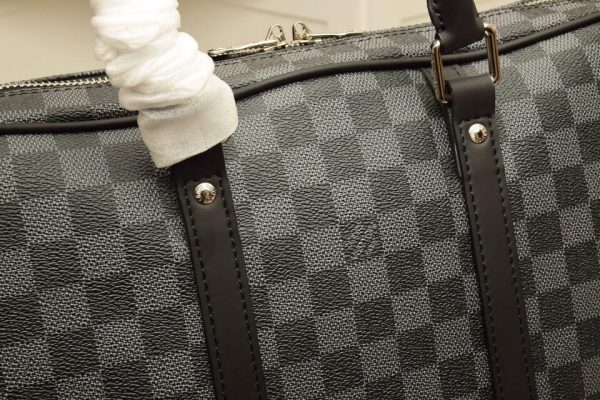 LOUIS VUITTON Porte-documents Voyage PM Eclipse Monogram