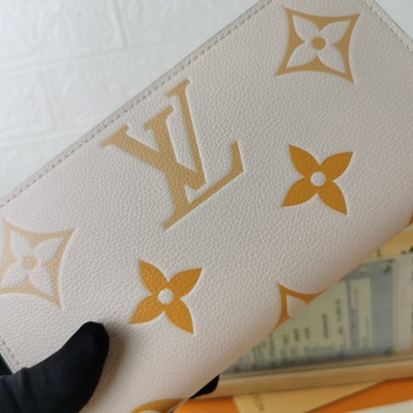 Bags Louis Vuitton Monogram Empreinte Zippy Women’s Wallet Claim Saffron M80402