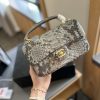 Chanel Mini Flap Bag with Top Handle in python