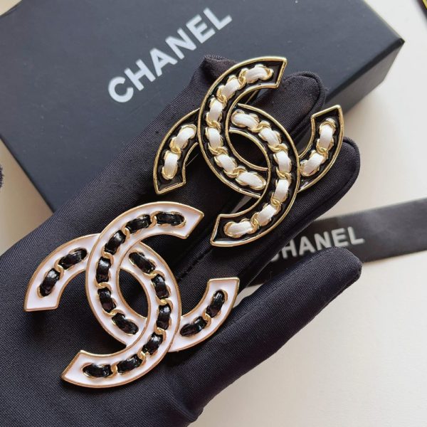 CHANEL CC BROOCH WHITE WITH BLACK INTERWOVEN CHAIN PATTERN