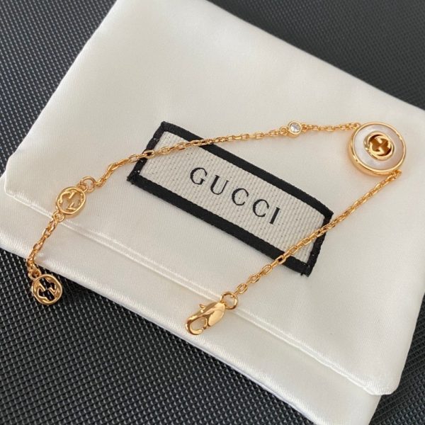 GUCCI INTERLOCKING GG BRACELET GOLD TONE 786749 J85I0 8070