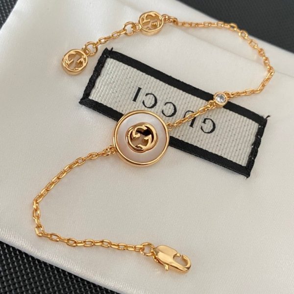 GUCCI INTERLOCKING GG BRACELET GOLD TONE 786749 J85I0 8070