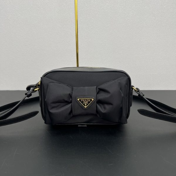 PRADA RE NYLON AND NAPPA MINI SHOULDER BAG WITH BOW BLACK 18CM 1BH166 RP0C F0002 V DXO