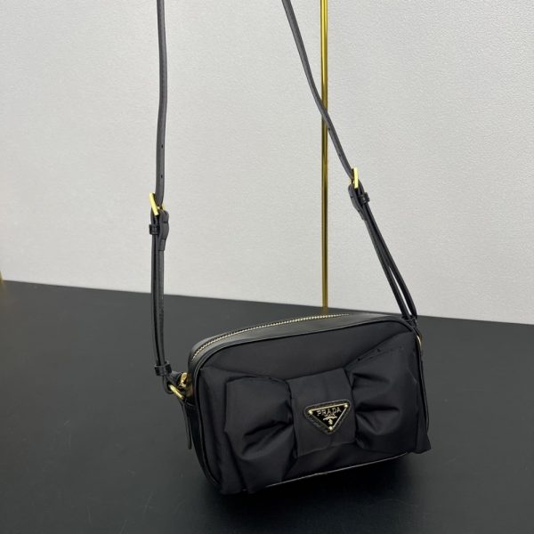 PRADA RE NYLON AND NAPPA MINI SHOULDER BAG WITH BOW BLACK 18CM 1BH166 RP0C F0002 V DXO