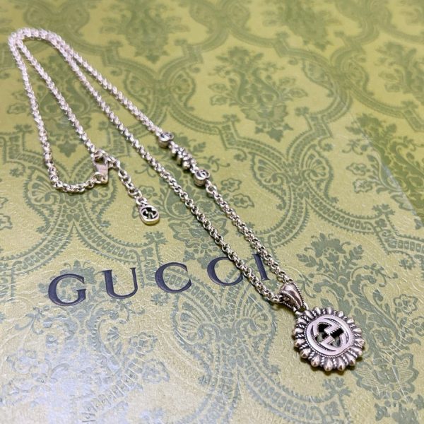 GUCCI INTERLOCKING G LOGO EMBELLISHED PENDANT STATION NECKLACE GOLD TONE